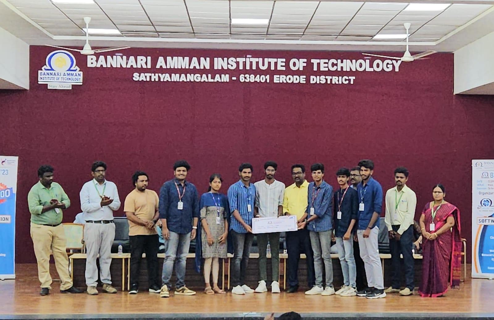A student team receives an award cheque onstage at Bannari Amman Institute of Technology.
